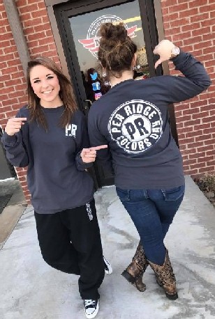 Two students in their school store's apparel