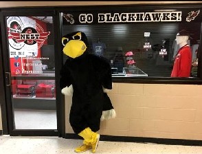 A school mascot at its store's counter